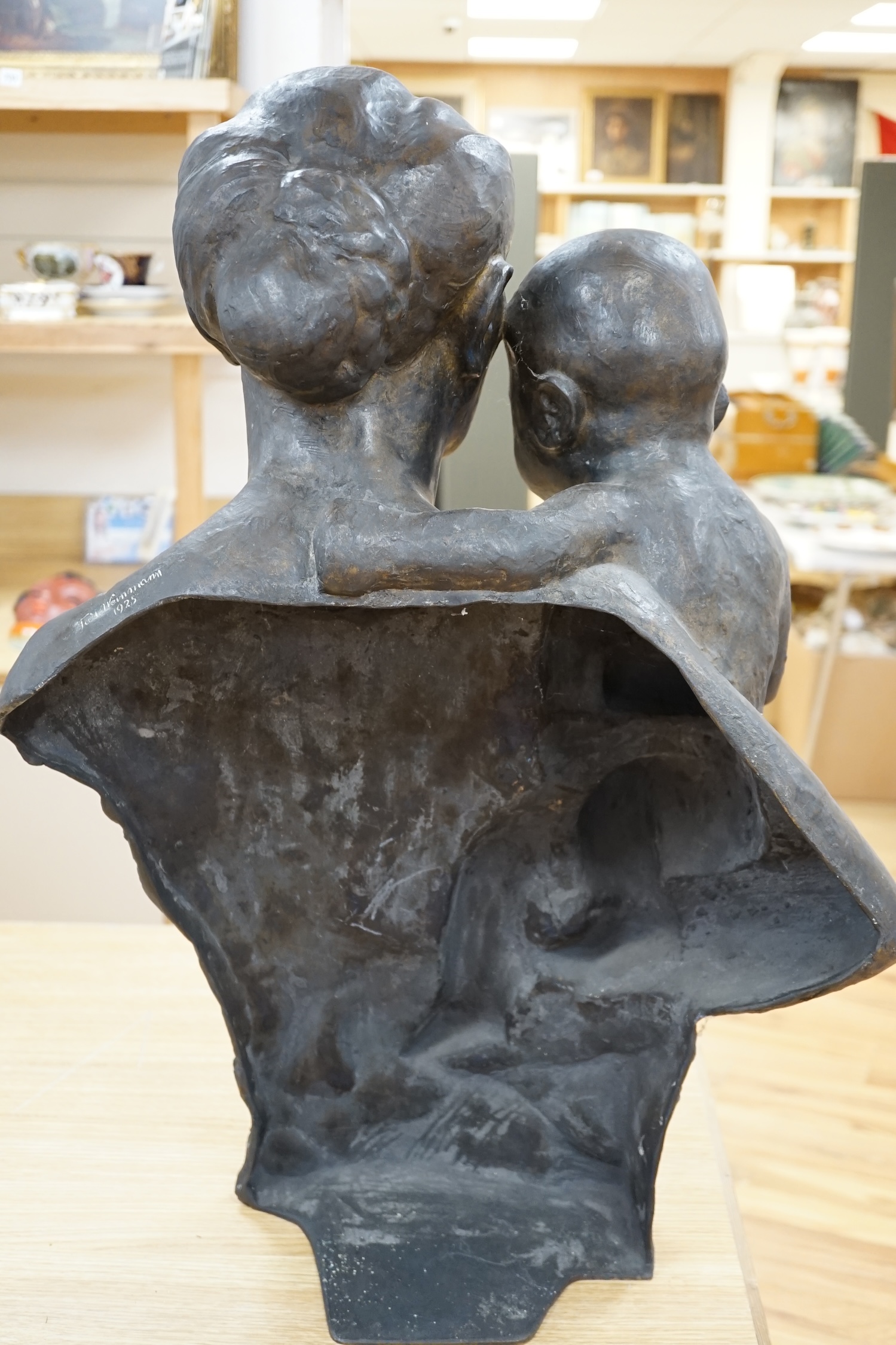 Turi Weinmann (German 1883-1950), a life size bronze bust of a mother and child, 73cm high. Condition - good